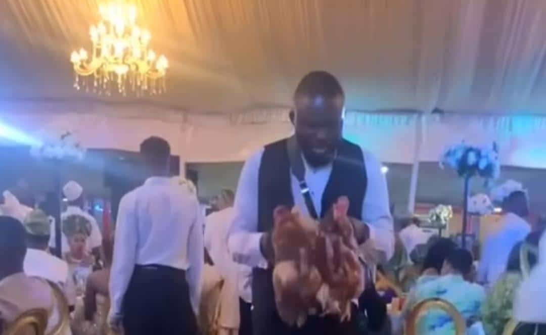 Drama as guests receive live chicken as souvenir at wedding party in Lagos (Video)