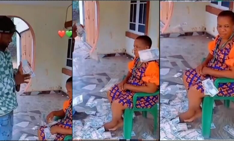 Mother acts unbothered as son sprays her loads of cash (Video)