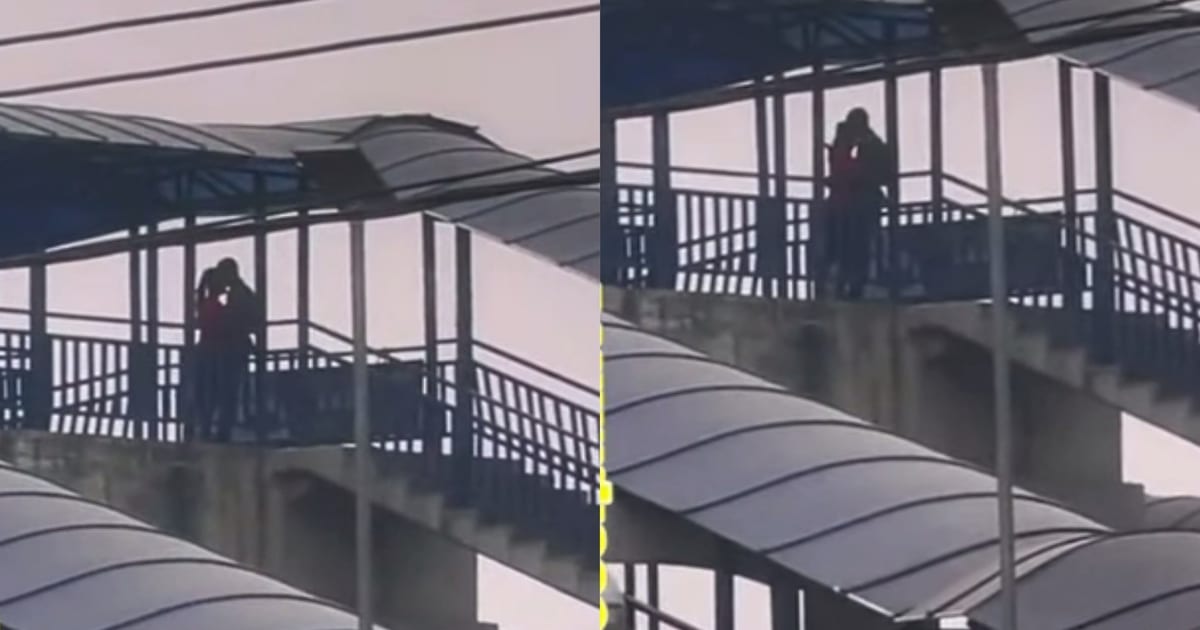 Couple spotted displaying affection on pedestrian bridge
