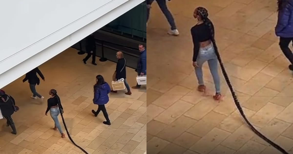 Lady draws stares at mall as she walks majestically with long braids (Video)