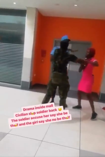 Lady lands back a slap on a soldier who first assaulted her