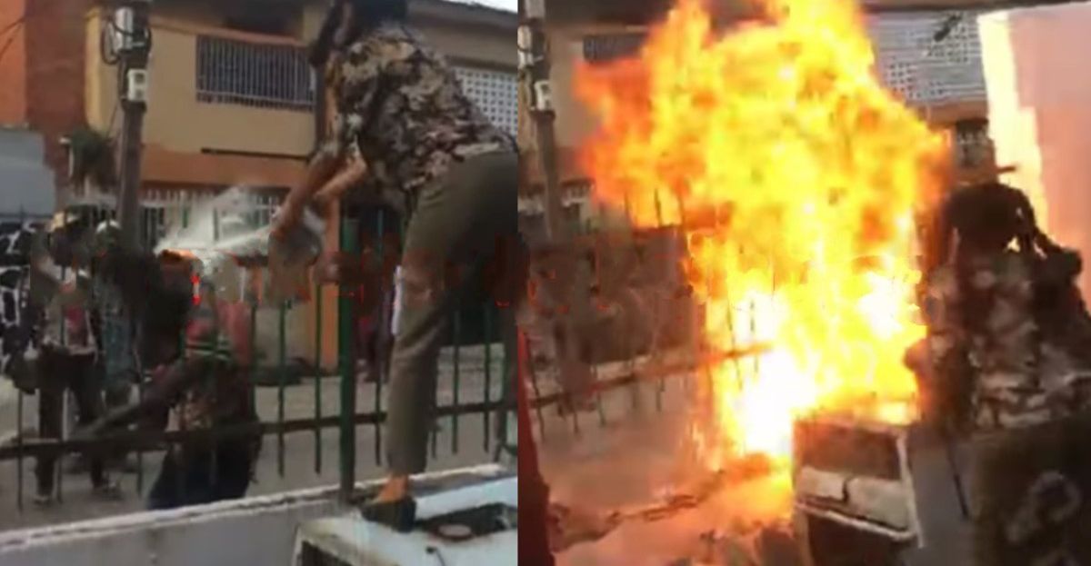 Woman sets fire on fence to repel 'landgrabbers' attempting to take over her family house in Lagos (Video)