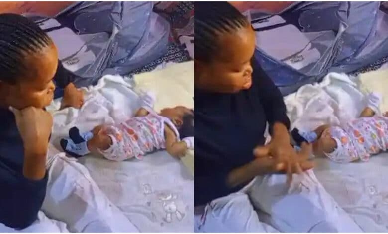"I feel your pain" - Nigerian mother cries as fresh baby rejects small bed, sleeps on big mattress