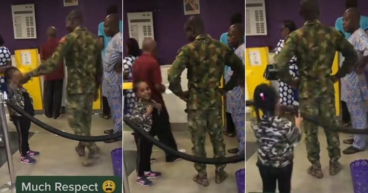 Nigerian soldier reacts as little girl walks to him in bank, salutes him