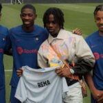 Rema visits Barcelona stars during training, gets customised jersey