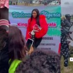 Police band, fans give Khosi a royal welcome as she arrives Nigeria
