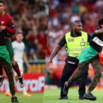 Ronaldo lifted up by pitch invader during Euro qualifiers match