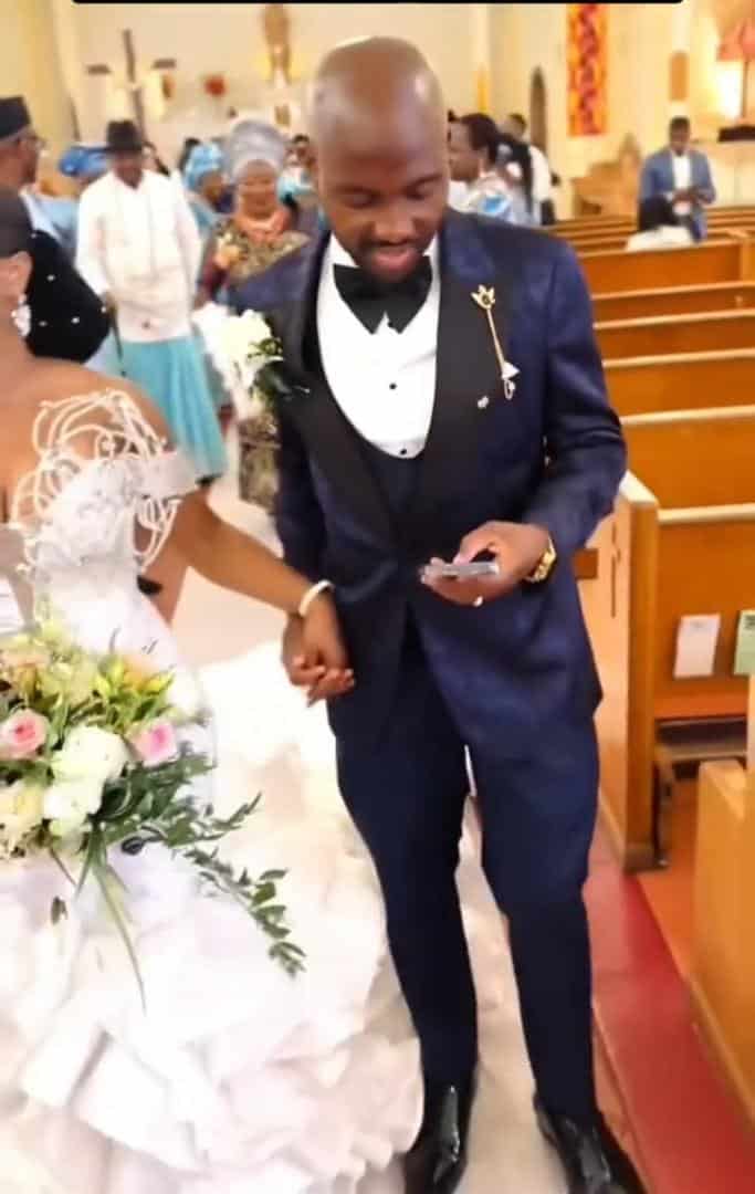 Groom seen pressing phone on wedding day sparks outrage (Video)