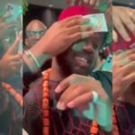Friends make it rain dollars on man during party (Video)