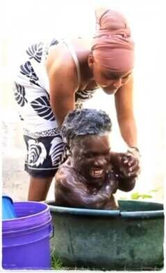 "True love" - Reactions as lady puts small man inside bowl, baths him like a baby