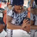 Endowed ladies massage heads of male clients at barbing salon