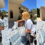 Rich woman fills up her compound with bundles of cash