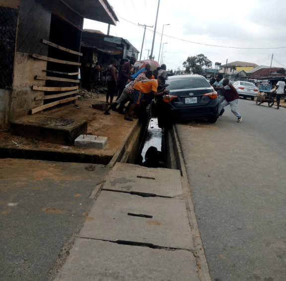 Moment car wash attendant narrowly escapes death after crashing customer's vehicle while test driving it in Port Harcourt