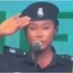 "How she take pass academy" - Mixed reactions as policewoman sings national anthem wrongly in confidence