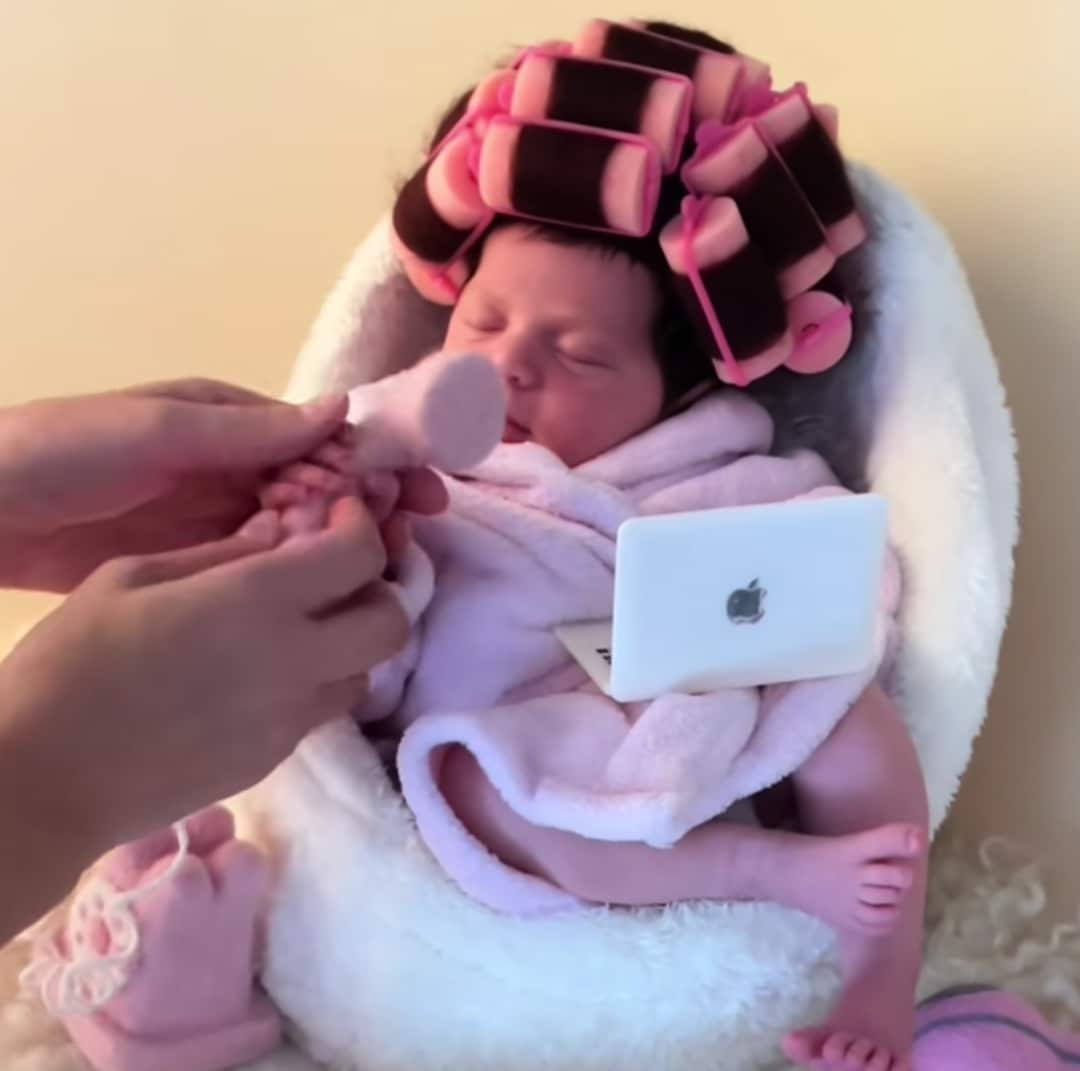 "She’s all about self care and soft life" - Little baby charms social media users with adorable poses in a photoshoot