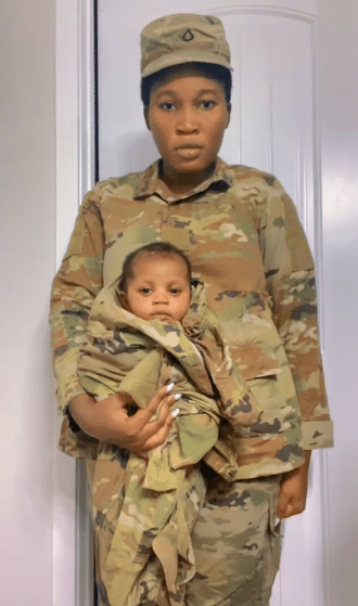 Female soldier causes buzz as she gives birth, wraps her baby in military camouflage