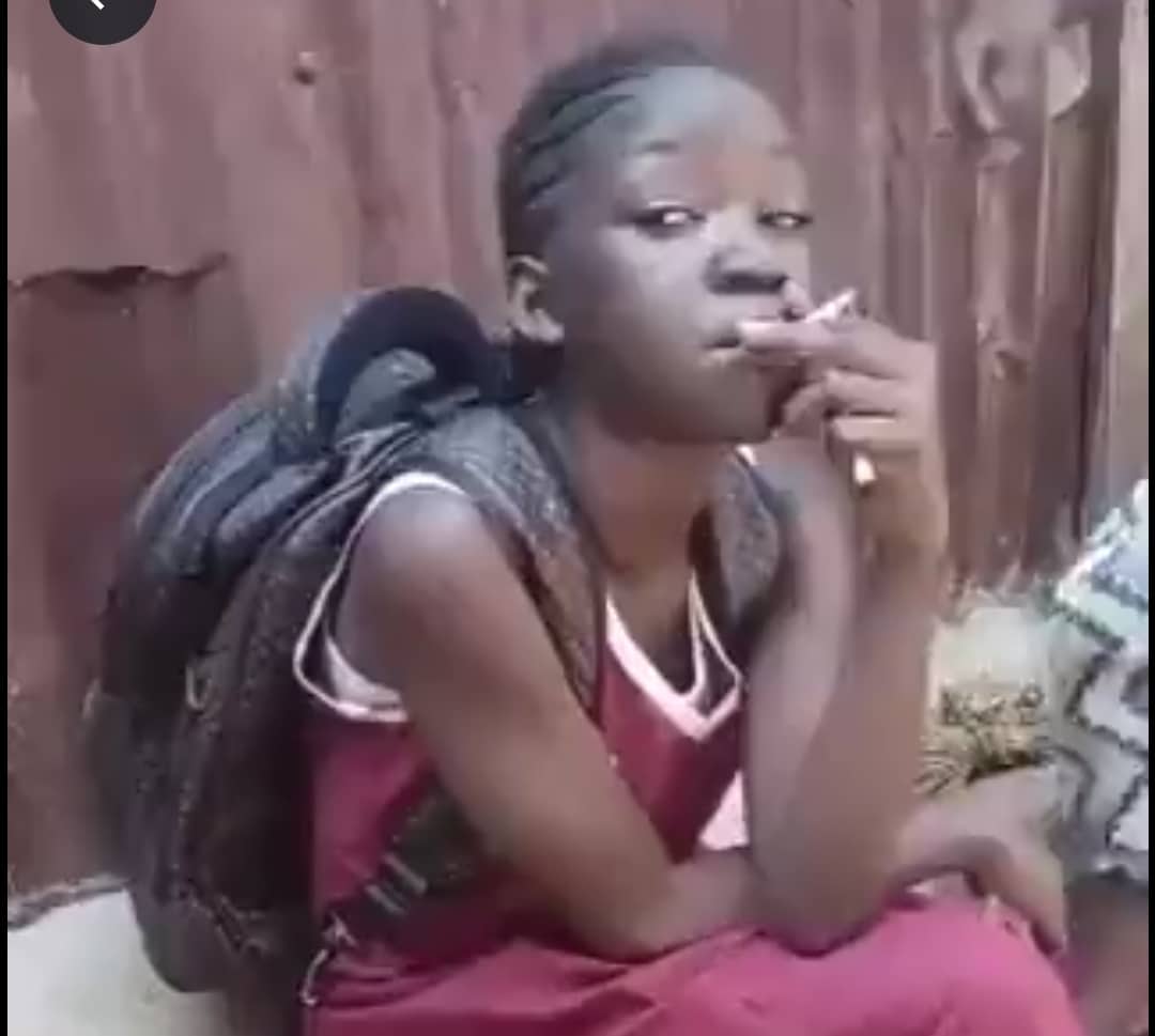Schoolgirl smokes cigarettes school