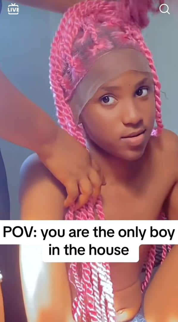 "He fine pass many girls" - Lady causes a buzz as she tests wig on her brother