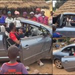 Man oppresses villagers as he arrives home for Christmas in convertible car